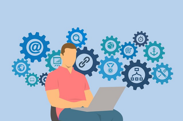 Illustrated man sitting in a chair with computer